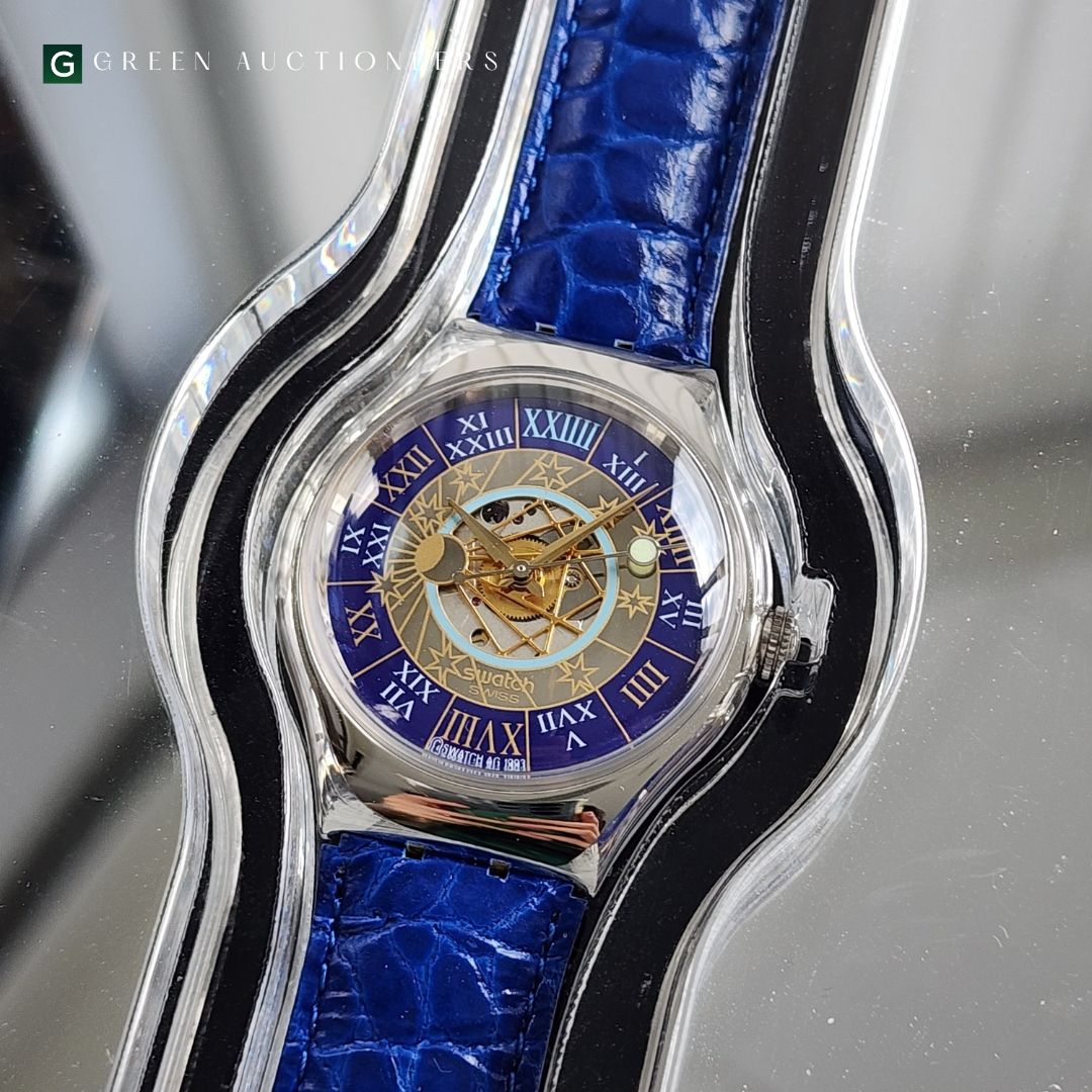 Swatch Trésor Magique SAZ101 Platinum Blue Latvia | Dealer